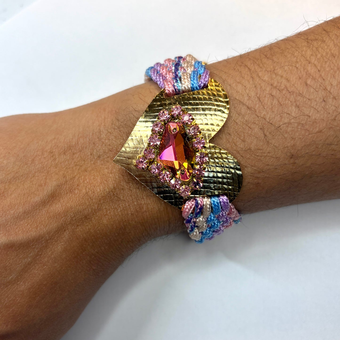 Woven bracelet with a gold-plated heart charm