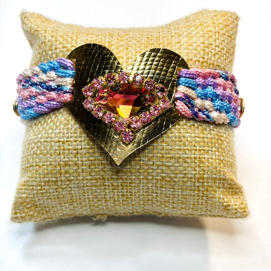 Woven bracelet with a gold-plated heart charm