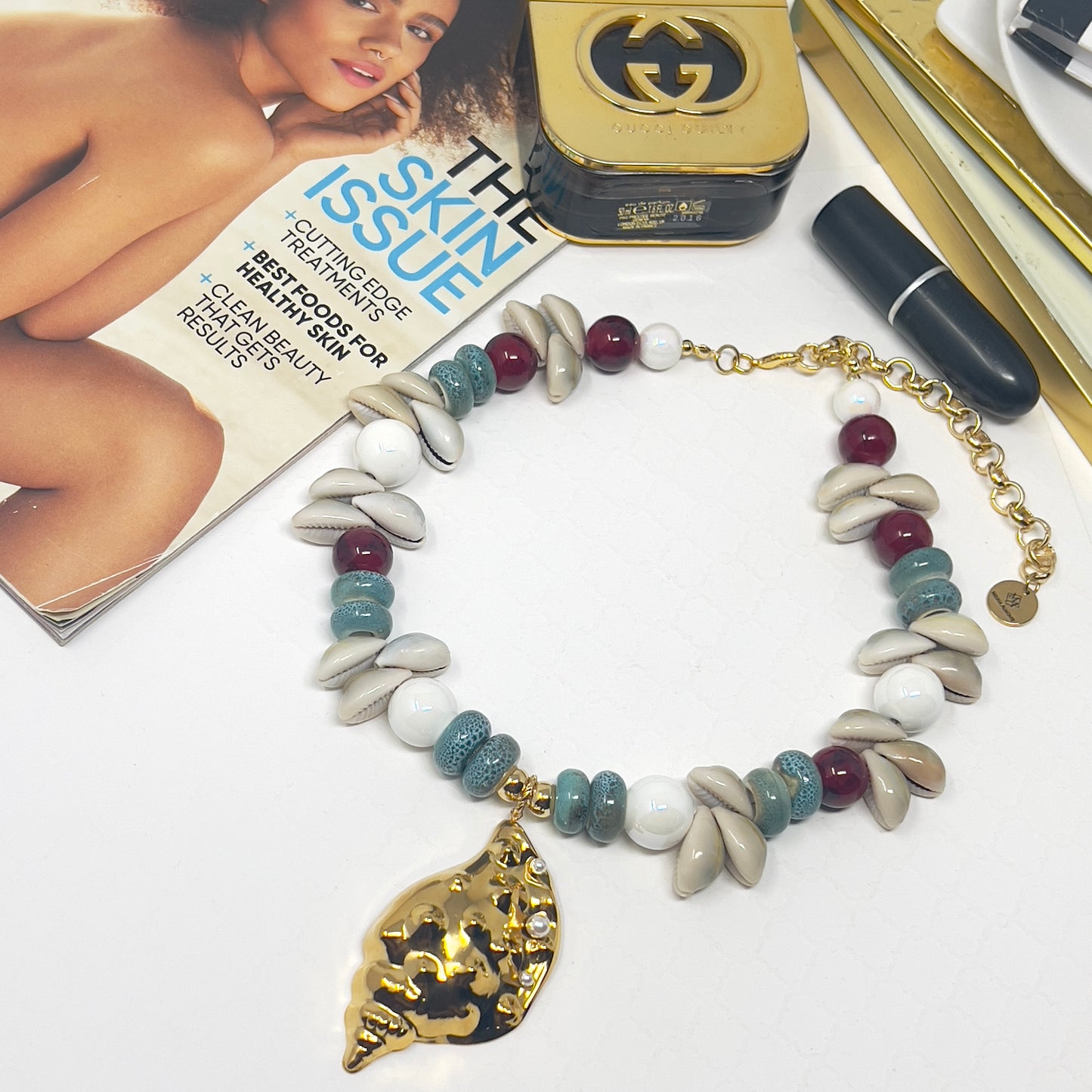 Handmade Cowrie Shell Necklace with Ceramic Beads and Gold Plated Conch Pendant – Adjustable Boho Beach Jewelry
