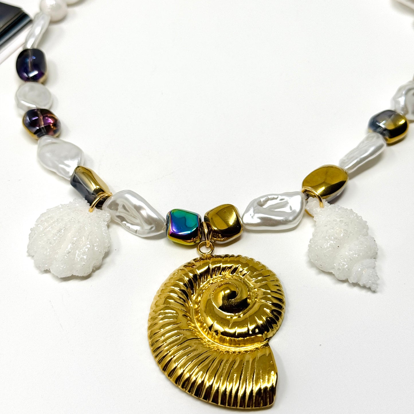 Handmade necklace of baroque pearls and Austrian crystals with gold-plated snail Pendant in stainless steel