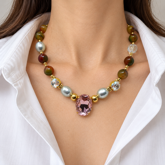 Mixed agate and pearl Swarovski crystal necklace worn with a white blouse.