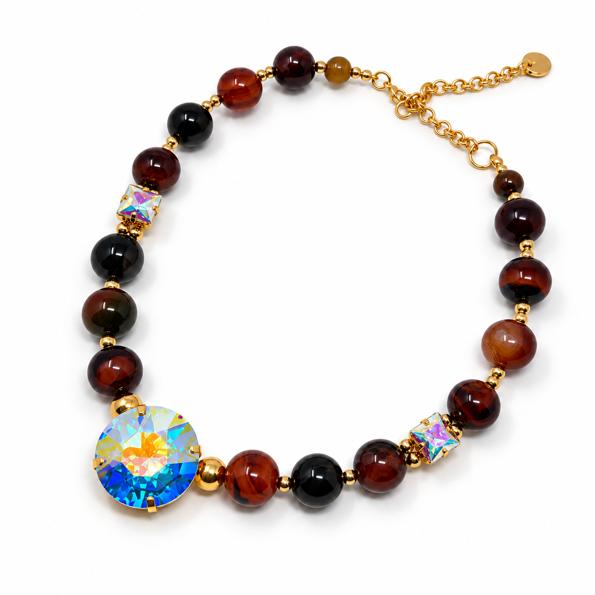 Natural agate bead necklace with three Aurora Borealis crystals and gold-tone accents on a white background.
