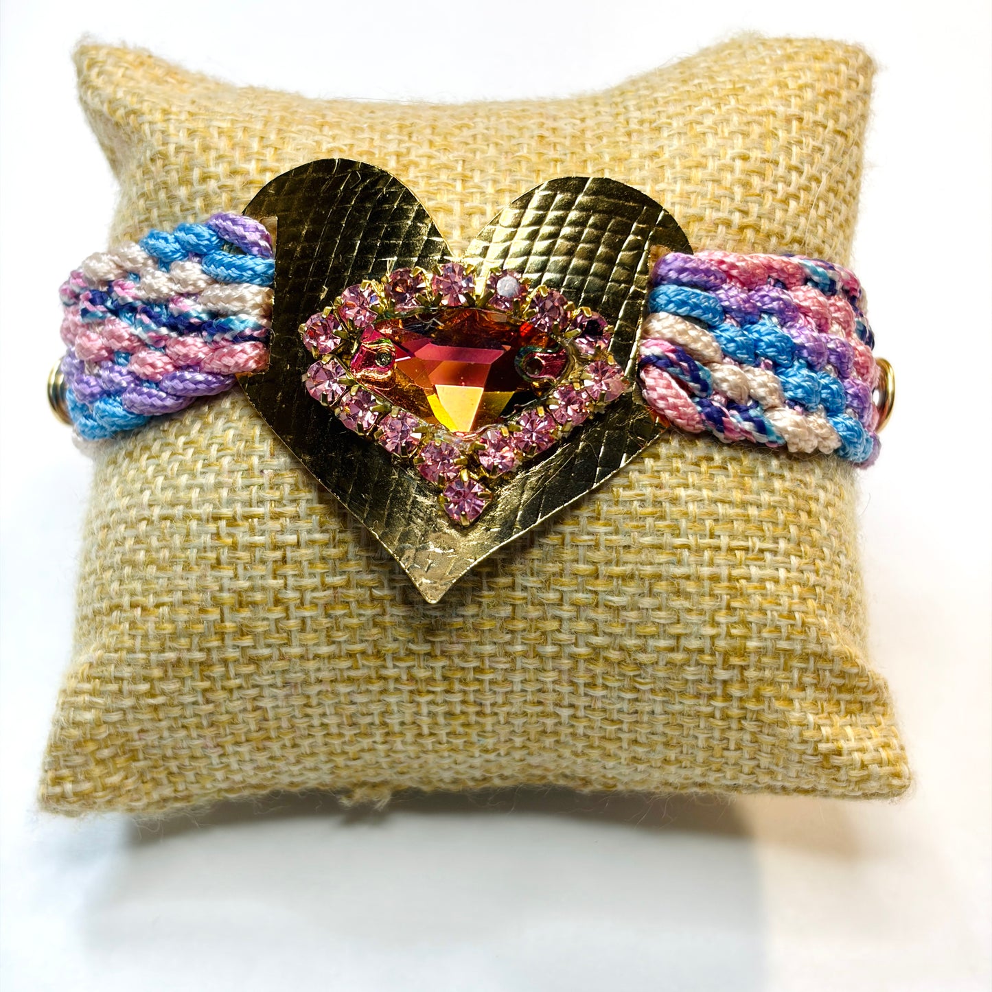 Woven bracelet with a gold-plated heart charm