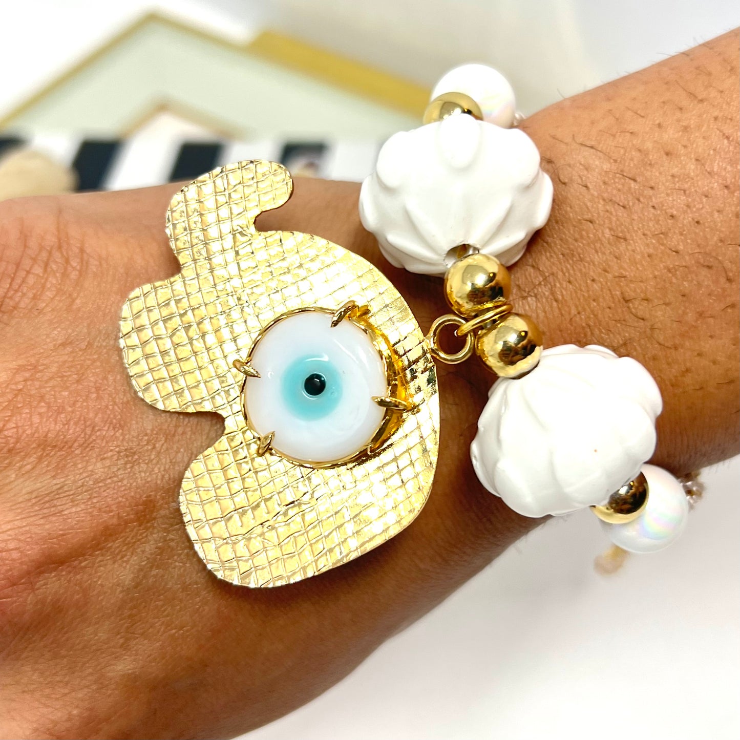Gold plated elephant charm bracelet with ceramic and gold plated beads woven in macrame
