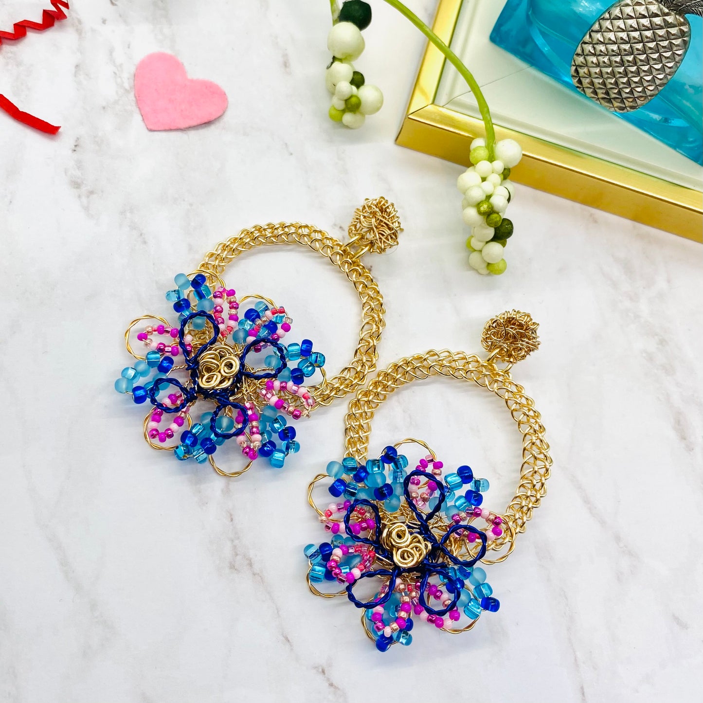 Gold wire embroidered circle with flower earring