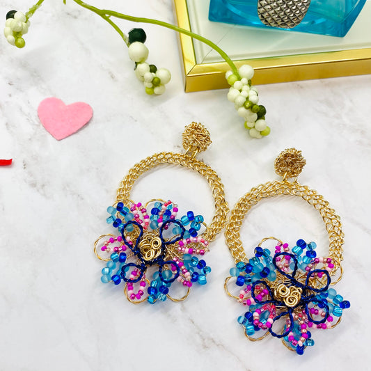 Gold wire embroidered circle with flower earring