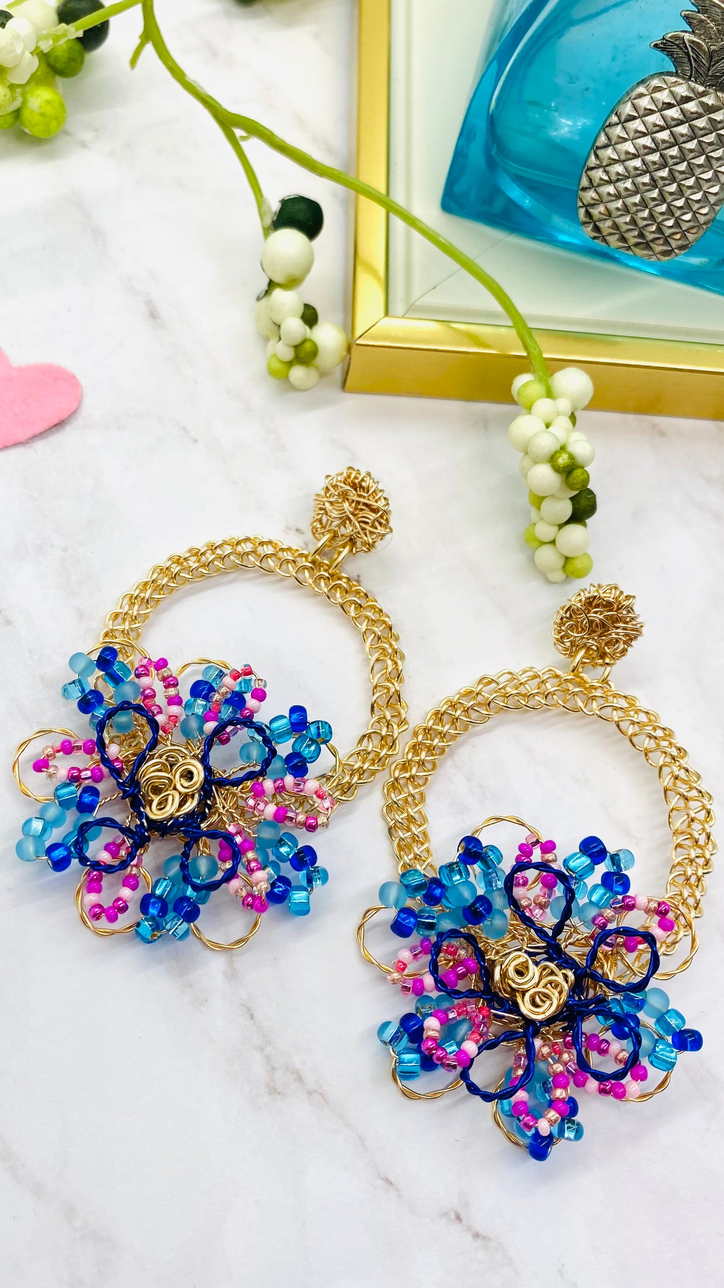 Gold wire embroidered circle with flower earring
