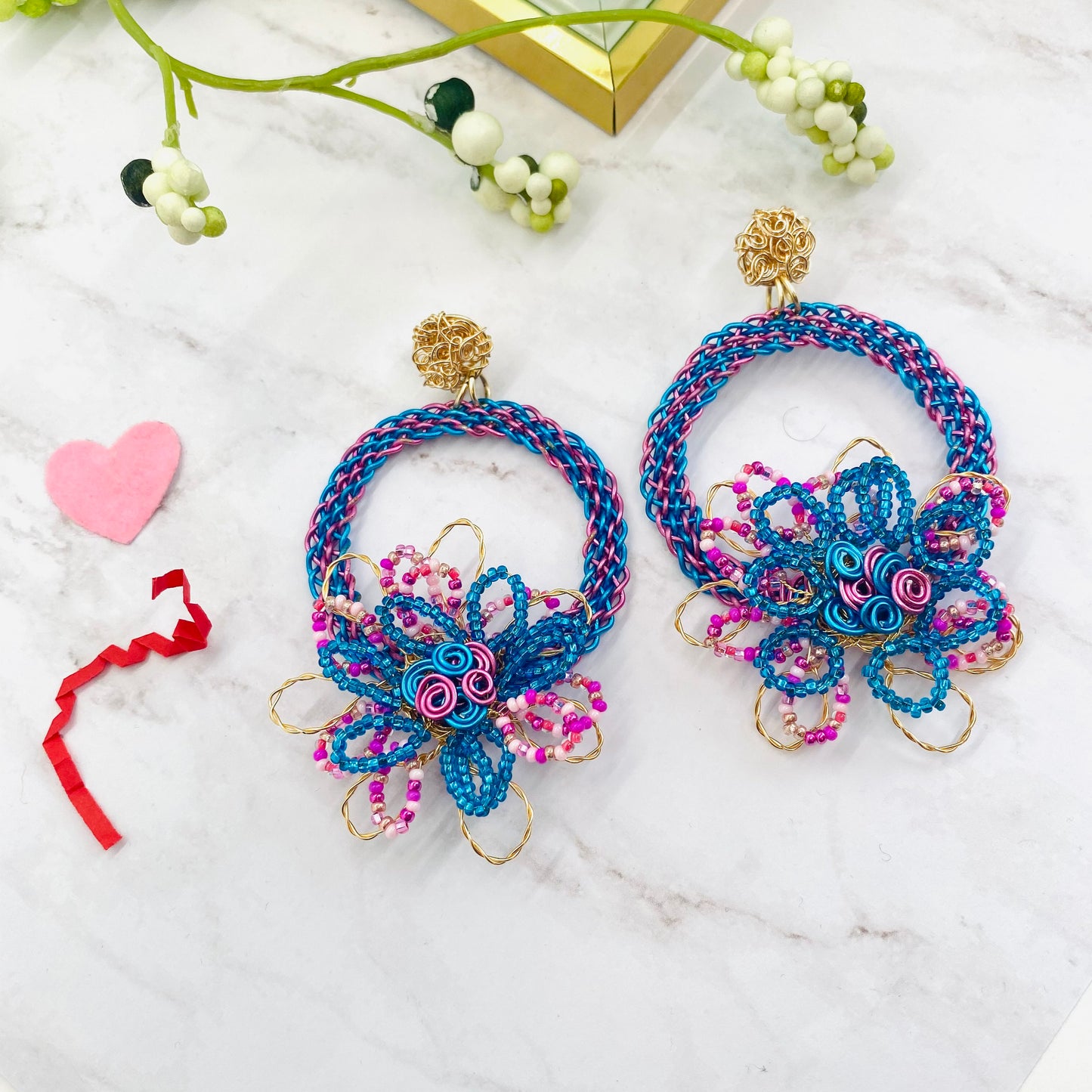 Gold wire embroidered circle with flower earring