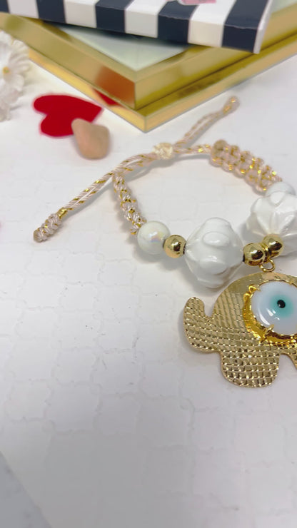 Gold plated elephant charm bracelet with ceramic and gold plated beads woven in macrame