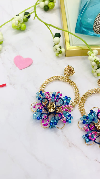 Gold wire embroidered circle with flower earring