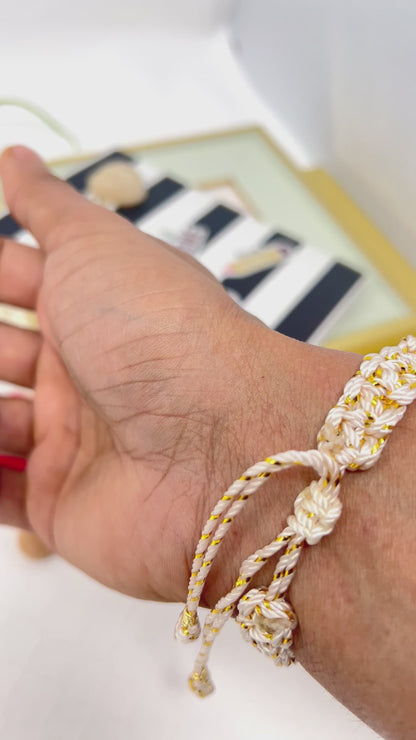 Gold plated elephant charm bracelet with ceramic and gold plated beads woven in macrame