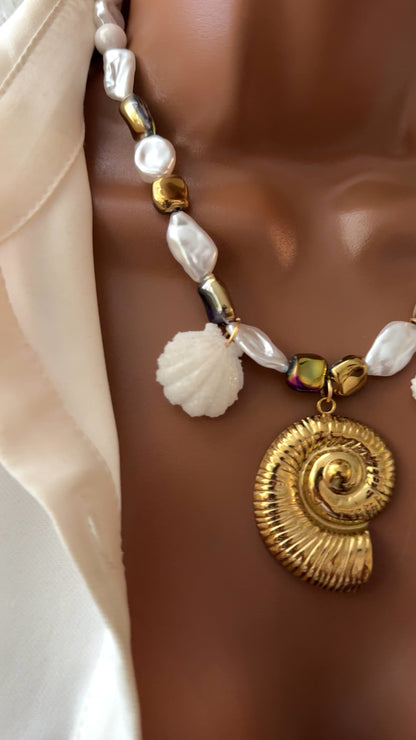 Handmade necklace of baroque pearls and Austrian crystals with gold-plated snail Pendant in stainless steel